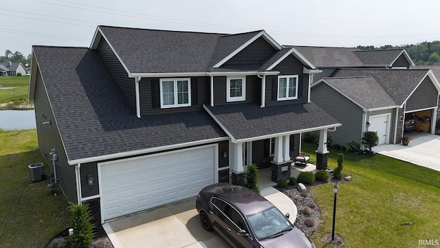 13710 Copper Strike Pass, Fort Wayne, IN 46845 - view of front of house with concrete driveway, roof with shingles, and a porch