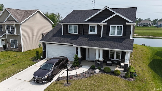 13710 Copper Strike Pass, Fort Wayne, IN 46845 - craftsman inspired home featuring covered porch, roof with shingles, and a front lawn