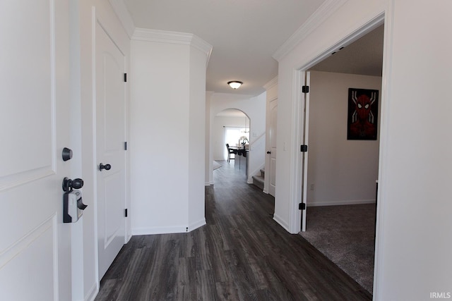 13710 Copper Strike Pass, Fort Wayne, IN 46845 - hallway with arched walkways, dark wood-type flooring, stairs, and crown molding