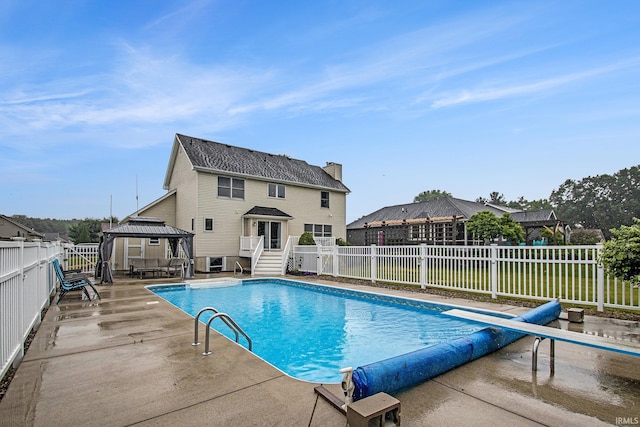 55887 Wild Game Dr, Osceola, IN 46561 - view of swimming pool with a gazebo, a fenced backyard, a diving board, and a patio