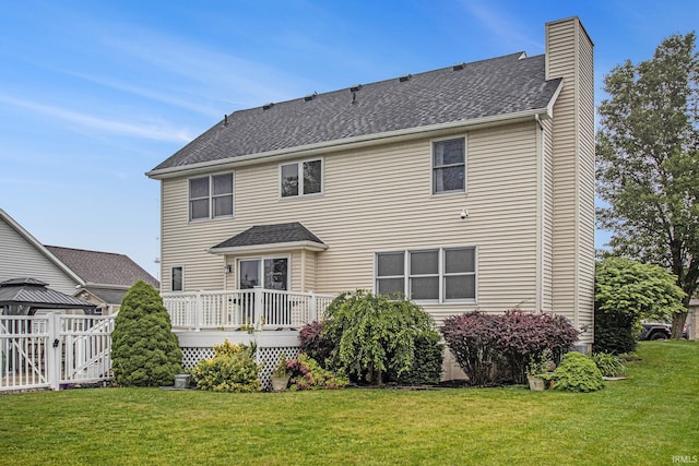 55887 Wild Game Dr, Osceola, IN 46561 - rear view of house featuring a chimney, a wooden deck, a shingled roof, and a gate