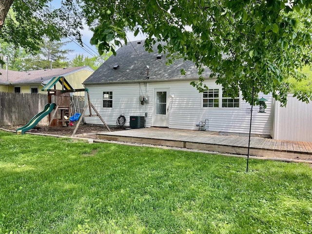 2927 Barnhart Ave, Fort Wayne, IN 46805 - rear view of house featuring a playground, a deck, and a shingled roof