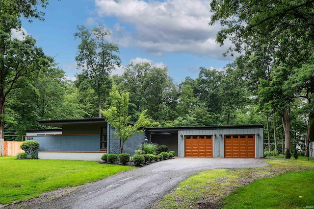 5219 Forest Grove Dr, Fort Wayne, IN 46835 - mid-century modern home featuring driveway and board and batten siding