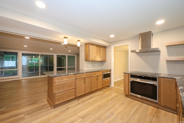 5219 Forest Grove Dr, Fort Wayne, IN 46835 - kitchen featuring appliances with stainless steel finishes, wall chimney exhaust hood, open shelves, light wood-style floors, and recessed lighting