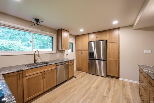 5219 Forest Grove Dr, Fort Wayne, IN 46835 - kitchen with appliances with stainless steel finishes, light wood-style flooring, recessed lighting, and dark stone counters