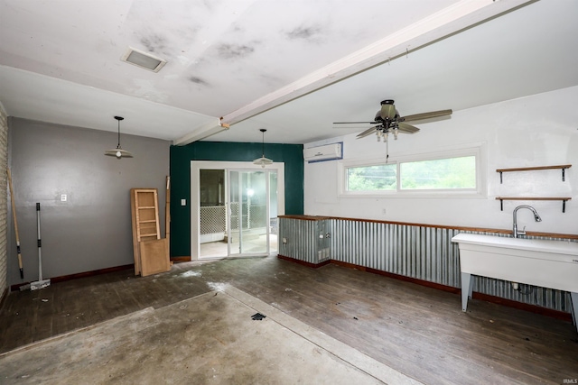 5219 Forest Grove Dr, Fort Wayne, IN 46835 - unfurnished living room featuring a ceiling fan, wood finished floors, and a wall unit AC
