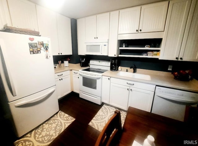 2629 S Meeker Ave, Muncie, IN 47302 - kitchen with white appliances, light countertops, white cabinetry, and dark wood finished floors