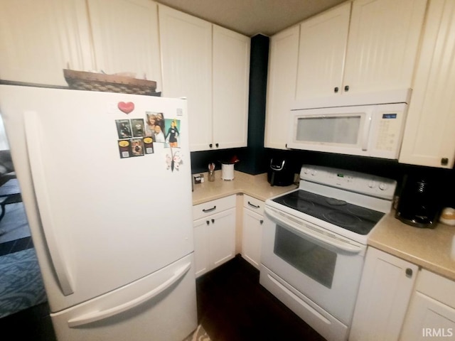 2629 S Meeker Ave, Muncie, IN 47302 - kitchen featuring white appliances, light countertops, white cabinetry, and dark wood finished floors