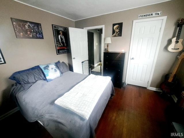 2629 S Meeker Ave, Muncie, IN 47302 - bedroom with dark wood finished floors and baseboards
