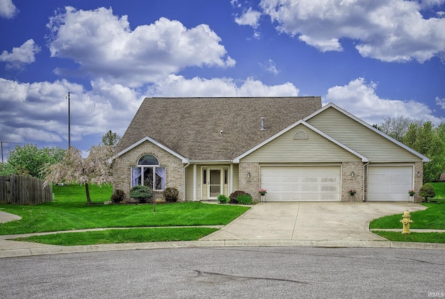 8005 Mackinac Cv, Fort Wayne, IN 46835 - view of front of property with brick siding, an attached garage, driveway, and roof with shingles