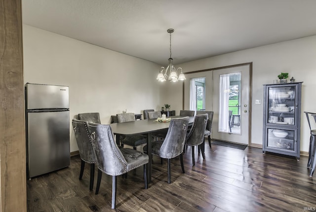 8005 Mackinac Cv, Fort Wayne, IN 46835 - dining space featuring a chandelier and dark wood-style floors