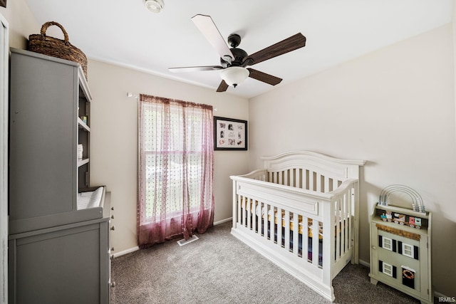 3822 Eastmont Dr, South Bend, IN 46628 - bedroom featuring carpet floors, a crib, and ceiling fan