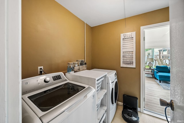 3822 Eastmont Dr, South Bend, IN 46628 - laundry room featuring washing machine and clothes dryer and light tile patterned floors