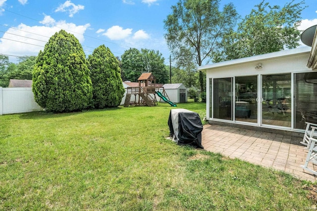 3822 Eastmont Dr, South Bend, IN 46628 - view of yard with a storage shed, a playground, and a patio
