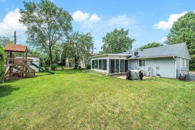 3822 Eastmont Dr, South Bend, IN 46628 - view of yard featuring a playground and a sunroom