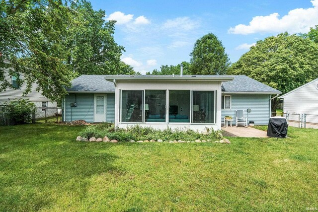 3822 Eastmont Dr, South Bend, IN 46628 - rear view of house with a sunroom and roof with shingles