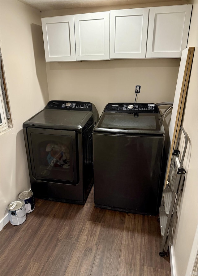 1207 Blackman St, Clinton, IN 47842 - laundry area with cabinet space, separate washer and dryer, and dark wood finished floors
