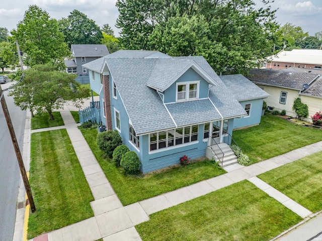 1209 S Jackson St, Auburn, IN 46706 - view of front of home featuring roof with shingles and a front lawn