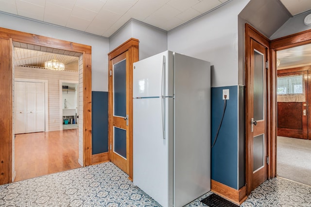 1209 S Jackson St, Auburn, IN 46706 - kitchen featuring freestanding refrigerator and a chandelier