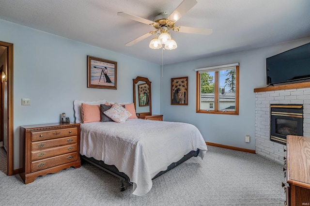 1209 S Jackson St, Auburn, IN 46706 - bedroom featuring light carpet, a brick fireplace, and ceiling fan