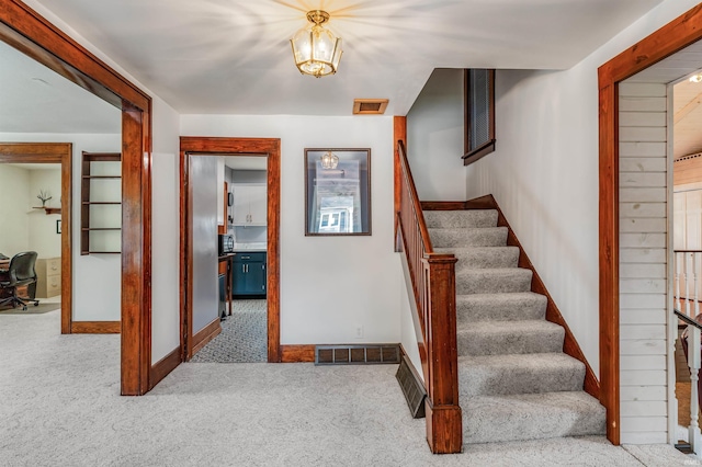 1209 S Jackson St, Auburn, IN 46706 - stairway with carpet flooring and baseboards
