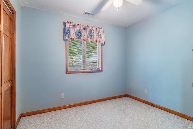 1209 S Jackson St, Auburn, IN 46706 - empty room featuring light colored carpet, a ceiling fan, and a textured ceiling