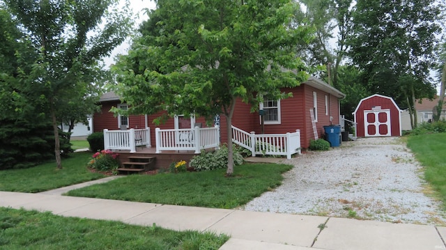 142 W Howard St, Galveston, IN 46932 - view of property hidden behind natural elements with a storage unit and a front lawn