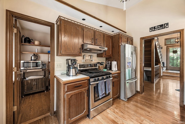 10880 Cougar Dr, Granger, IN 46530 - kitchen with stainless steel appliances, under cabinet range hood, and light wood-type flooring