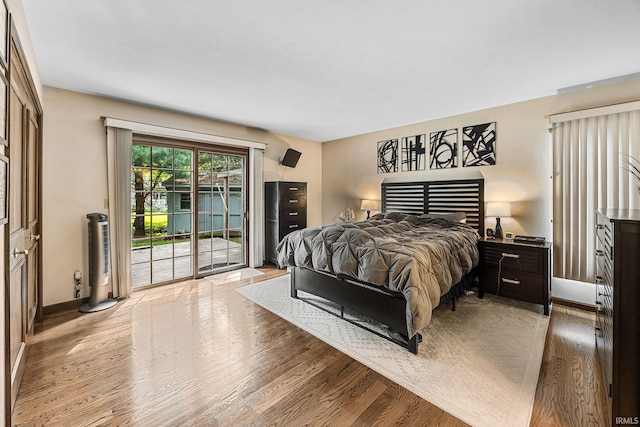 10880 Cougar Dr, Granger, IN 46530 - bedroom with access to exterior and light wood-style flooring