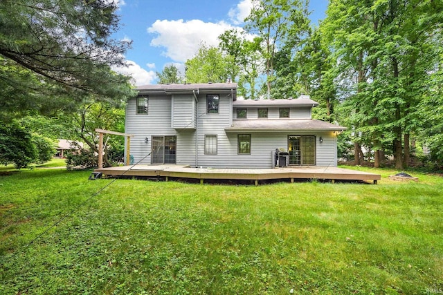 10880 Cougar Dr, Granger, IN 46530 - back of house featuring a deck and a lawn
