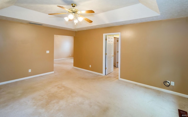 9040 Clear Creek Dr, Evansville, IN 47711 - unfurnished room featuring ceiling fan, light carpet, and a tray ceiling