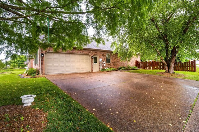 9040 Clear Creek Dr, Evansville, IN 47711 - ranch-style home with concrete driveway, brick siding, and an attached garage