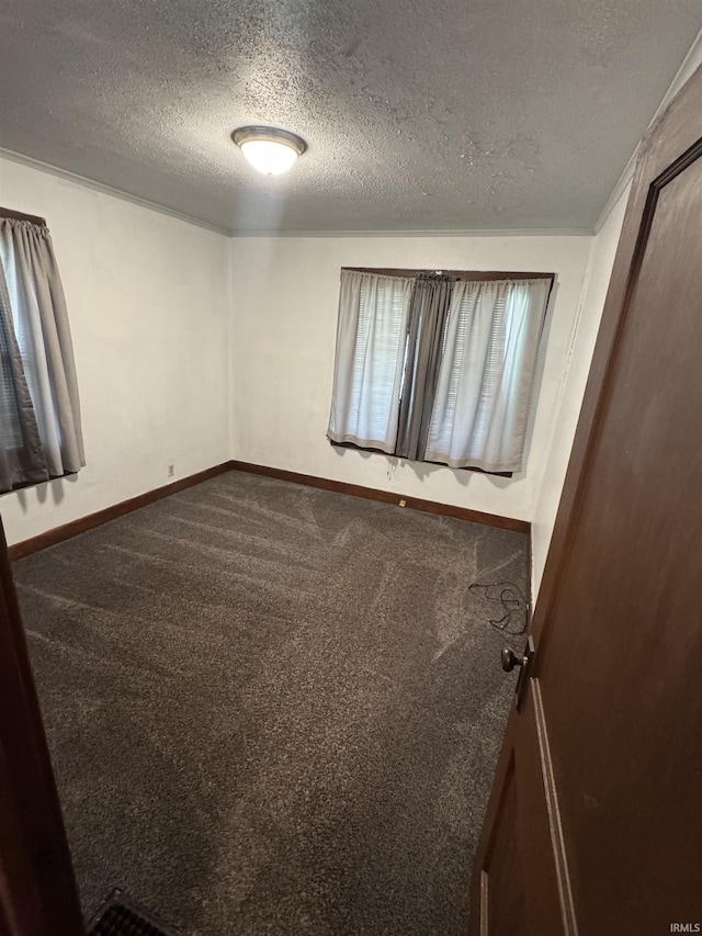 3316 Central Dr, Fort Wayne, IN 46806 - unfurnished bedroom featuring dark colored carpet and a textured ceiling