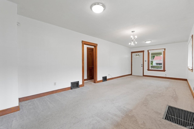 3316 Central Dr, Fort Wayne, IN 46806 - spare room with a chandelier and light carpet