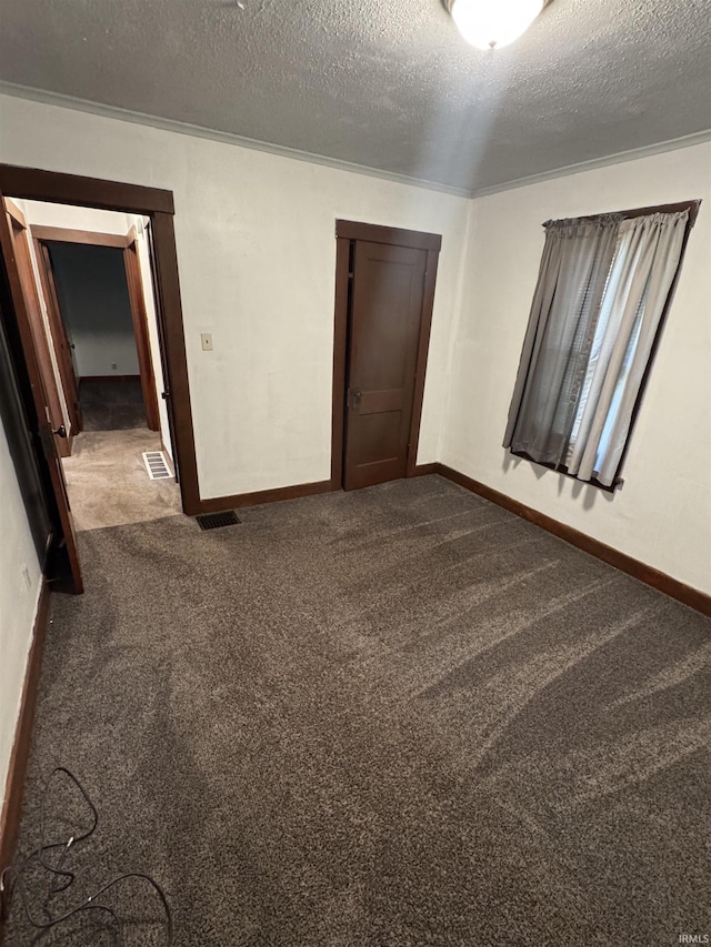 3316 Central Dr, Fort Wayne, IN 46806 - empty room featuring dark carpet and a textured ceiling