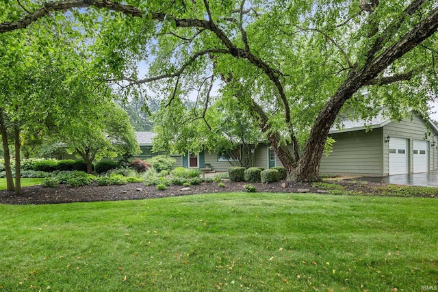 2107 W 450 S, Lafayette, IN 47909 - view of green lawn featuring a garage