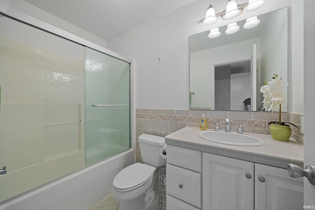 2107 W 450 S, Lafayette, IN 47909 - bathroom with vanity, combined bath / shower with glass door, tile walls, and a wainscoted wall