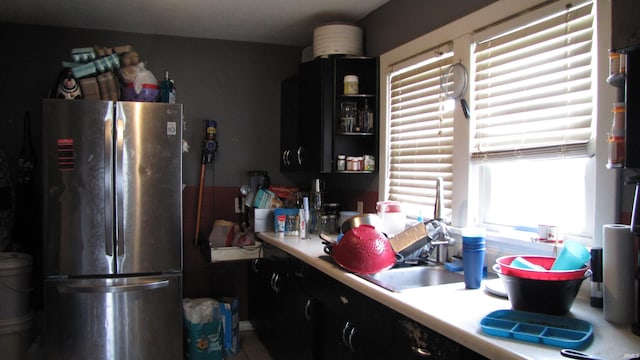 230 W Morton St, Oakland City, IN 47660 - kitchen with freestanding refrigerator, light countertops, and tile patterned floors