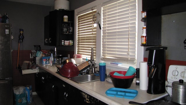 230 W Morton St, Oakland City, IN 47660 - kitchen featuring freestanding refrigerator and light countertops