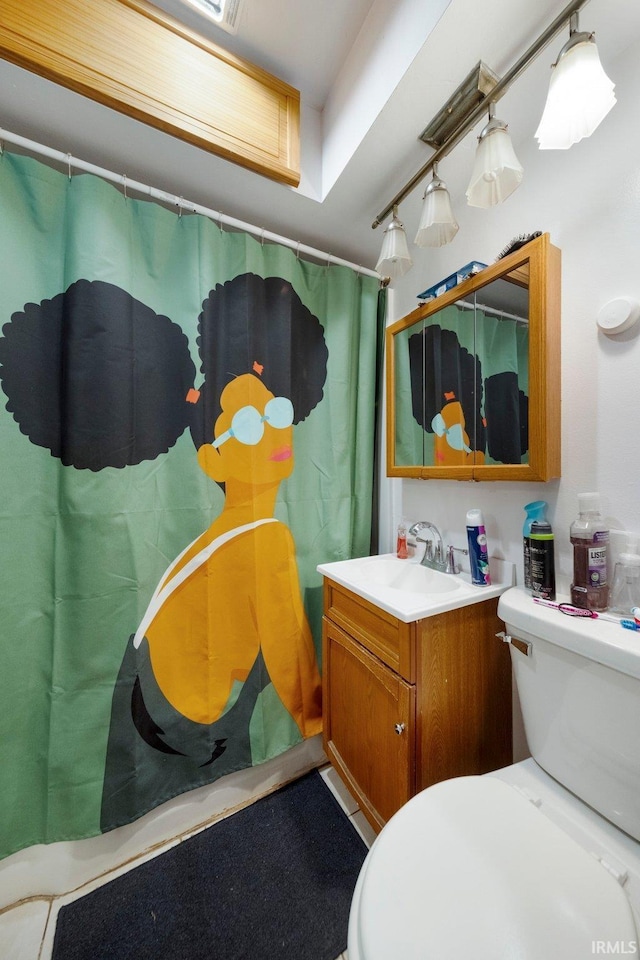 3420 Mccormick Ave, Fort Wayne, IN 46803 - full bath featuring vanity, rail lighting, and a shower with shower curtain