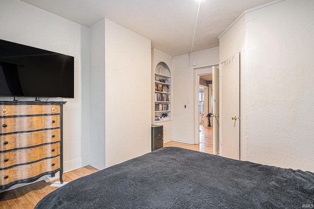 641 W Lexington Ave, Elkhart, IN 46514 - bedroom featuring light wood-style flooring and a textured wall