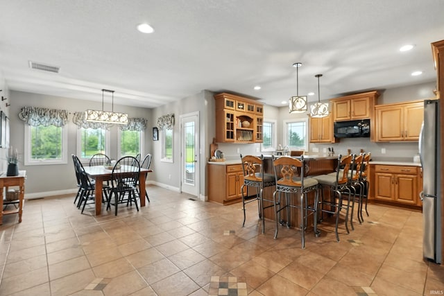 3908 County Road 4, Ashley, IN 46705 - dining area with recessed lighting, healthy amount of natural light, and light tile patterned floors