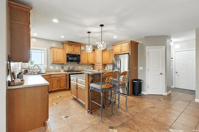 3908 County Road 4, Ashley, IN 46705 - kitchen featuring appliances with stainless steel finishes, a kitchen island, a kitchen breakfast bar, recessed lighting, and light tile patterned flooring