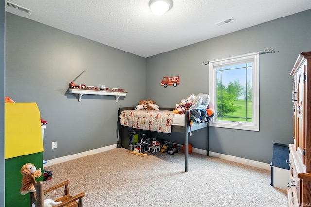 3908 County Road 4, Ashley, IN 46705 - carpeted bedroom with a textured ceiling and baseboards