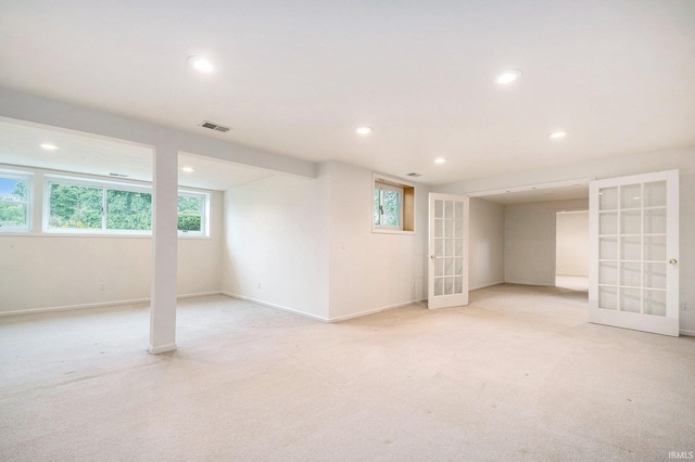 16340 Wellington Pkwy, Granger, IN 46530 - below grade area featuring french doors, recessed lighting, light carpet, and healthy amount of natural light