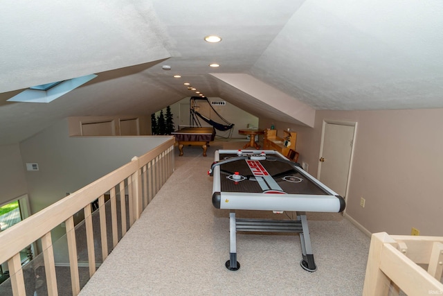 24413 Mckelvey Ave, Elkhart, IN 46516 - recreation room with carpet, vaulted ceiling, and recessed lighting