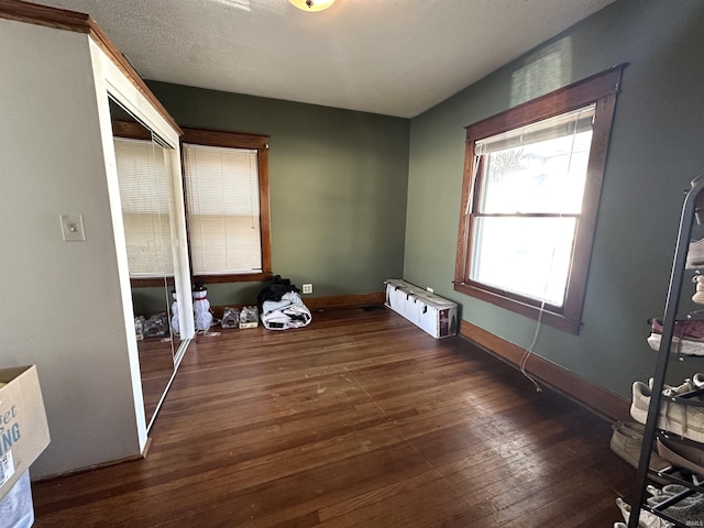 419 W Jefferson St, Kokomo, IN 46901 - unfurnished bedroom featuring hardwood / wood-style flooring and baseboards