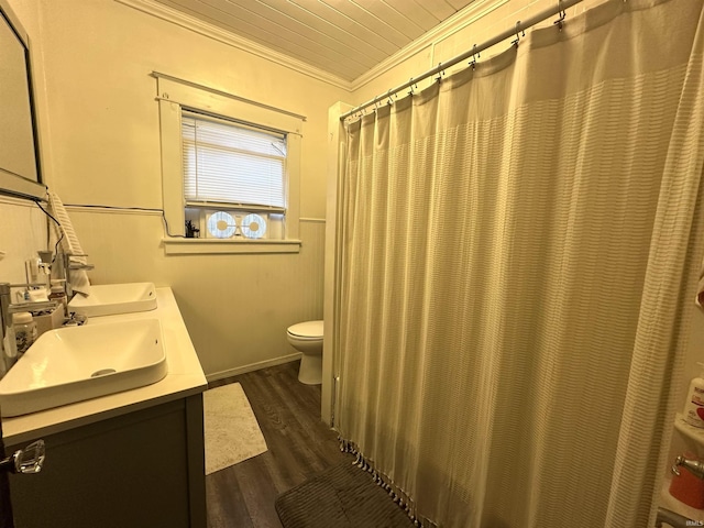 419 W Jefferson St, Kokomo, IN 46901 - bathroom with ornamental molding, double vanity, wood finished floors, and a shower with curtain