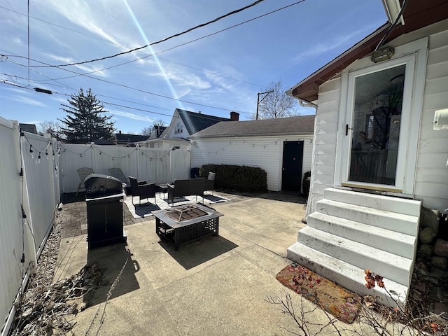 419 W Jefferson St, Kokomo, IN 46901 - fenced backyard with entry steps, an outdoor fire pit, a patio, and grilling area