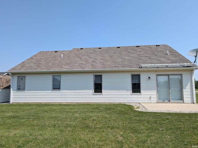 117 Blue Heron Cv, Decatur, IN 46733 - rear view of house with a patio, a lawn, and roof with shingles